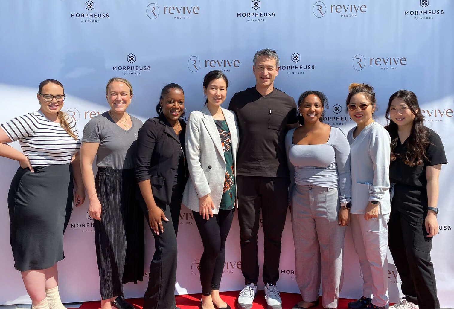 Six people standing and posing for a picture